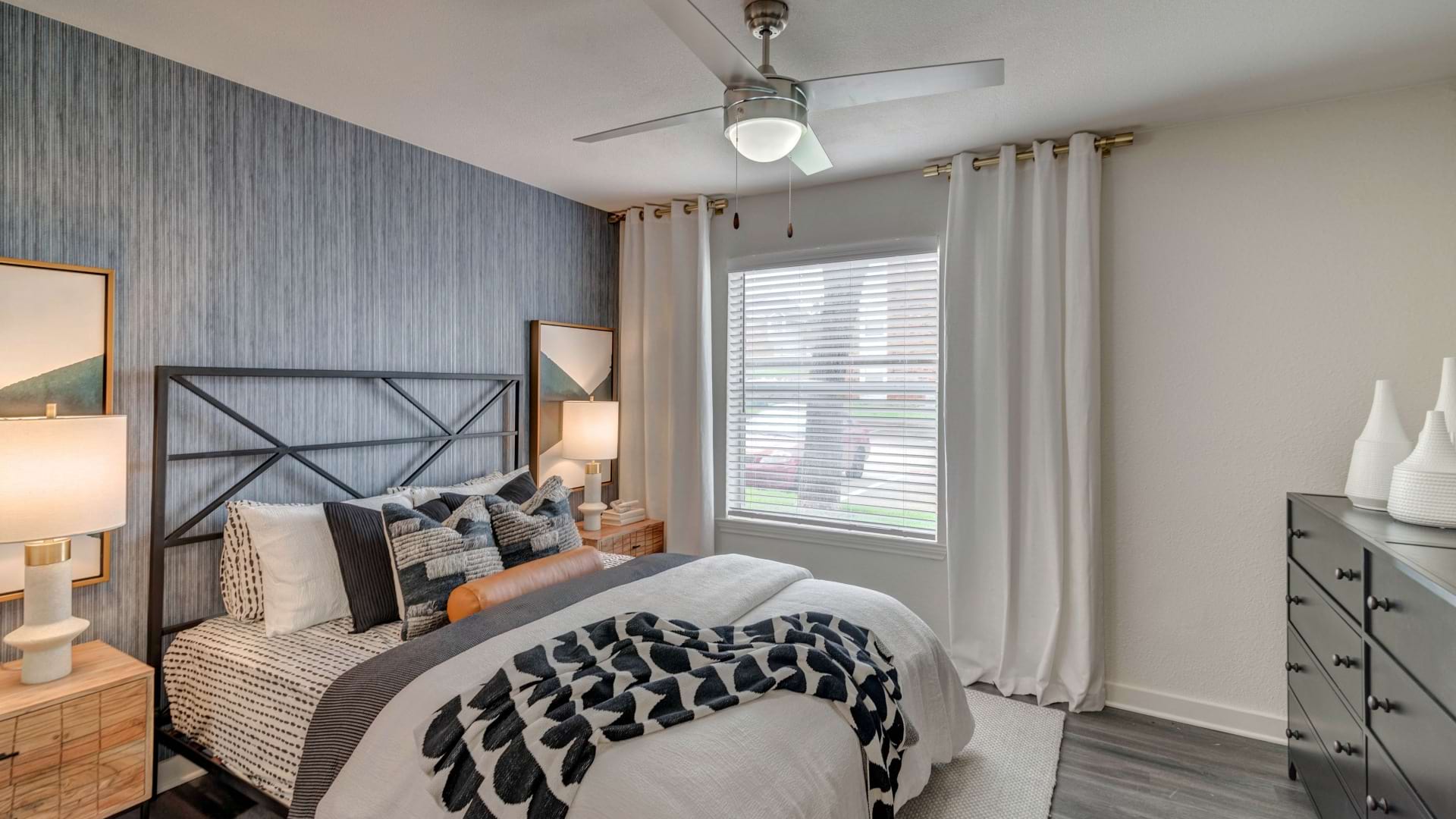 Charming Bedroom with a Large Window in Our Bedford, TX Apartments