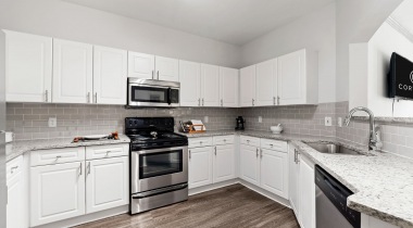 Luxurious Kitchen with Energy-Efficient, Stainless Steel Appliances at Our Johns Creek, Georgia Apartments