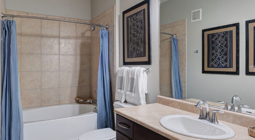 Bathroom with a Deep-Soaking Tub in Our UTMB Apartments