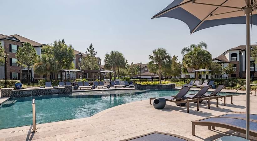 Lounge Chairs and Resort-Style Pool at Our Apartments in League City on 96