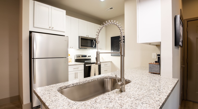 Custom Cabinetry with Under-Cabinet Lighting, Designer Hardware, and Tile Backsplashes 