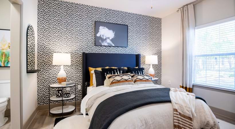 Bedroom with Large Window at Our Apartments on Mallard Creek