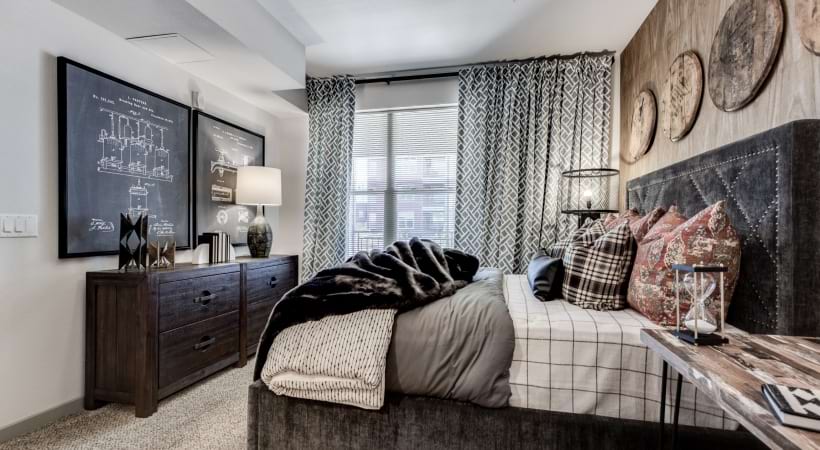 Spacious Bedroom with Cozy Carpet and Walk-In Closets at Our apartments For Rent in Colorado Springs, CO