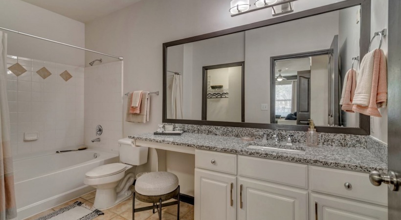 Bathroom With Deep-Soaking Bathtub At Our Upscale Apartments In South Fort Worth