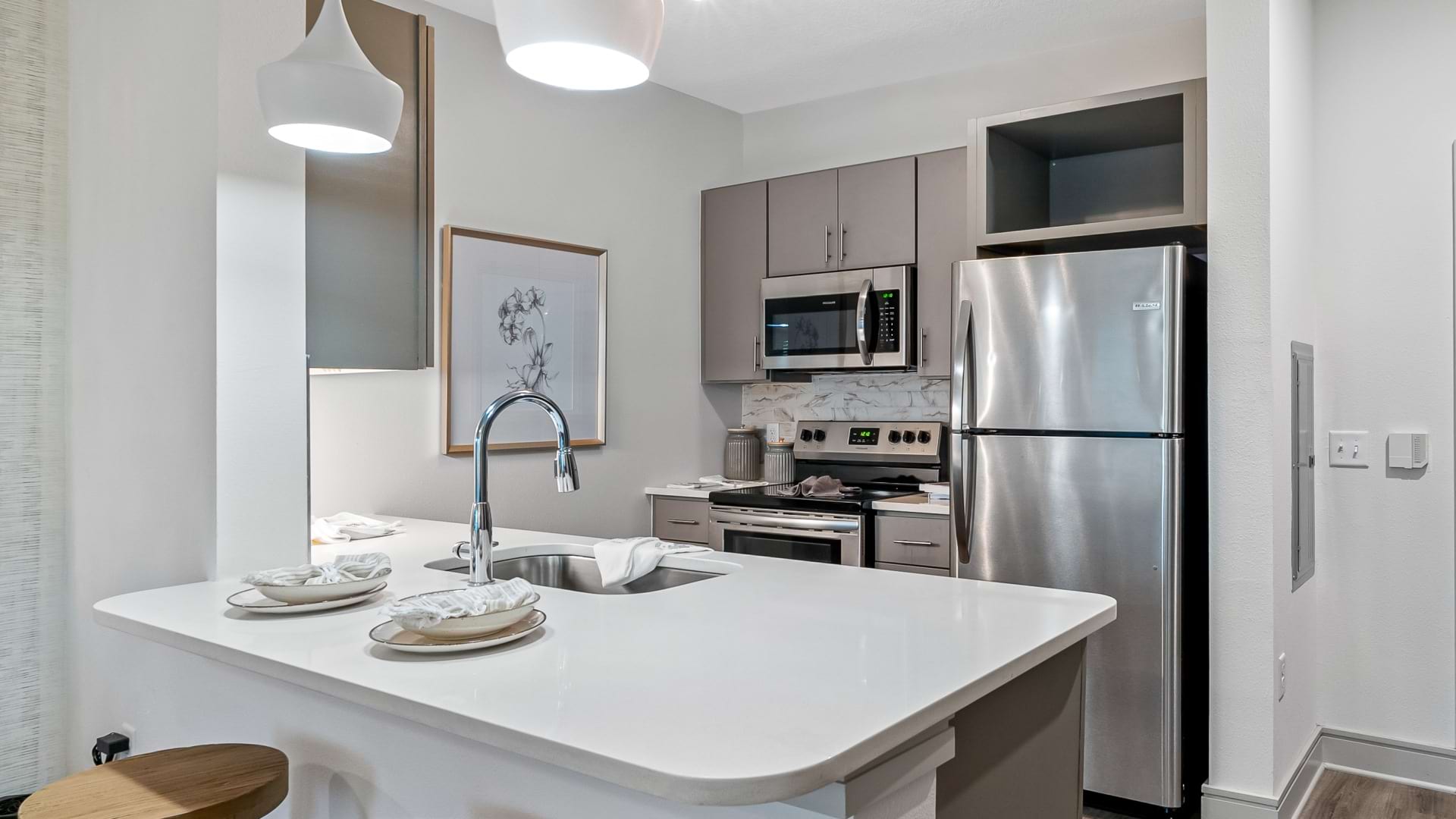 Modern Kitchen with Wood-Style Flooring at Our Apartment in St.Petersburg FL
