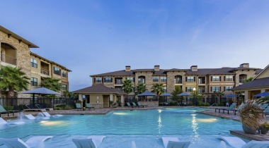 Resort-Style Apartment Pool With Lounging Chairs At Our Apartments Near Downtown Houston