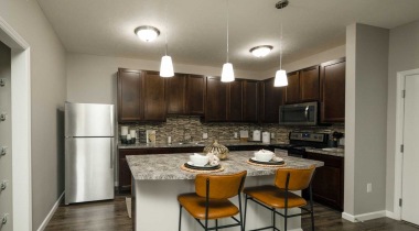 Open-Concept Kitchen with Granite Island at Our Sunbury Apartments for Rent