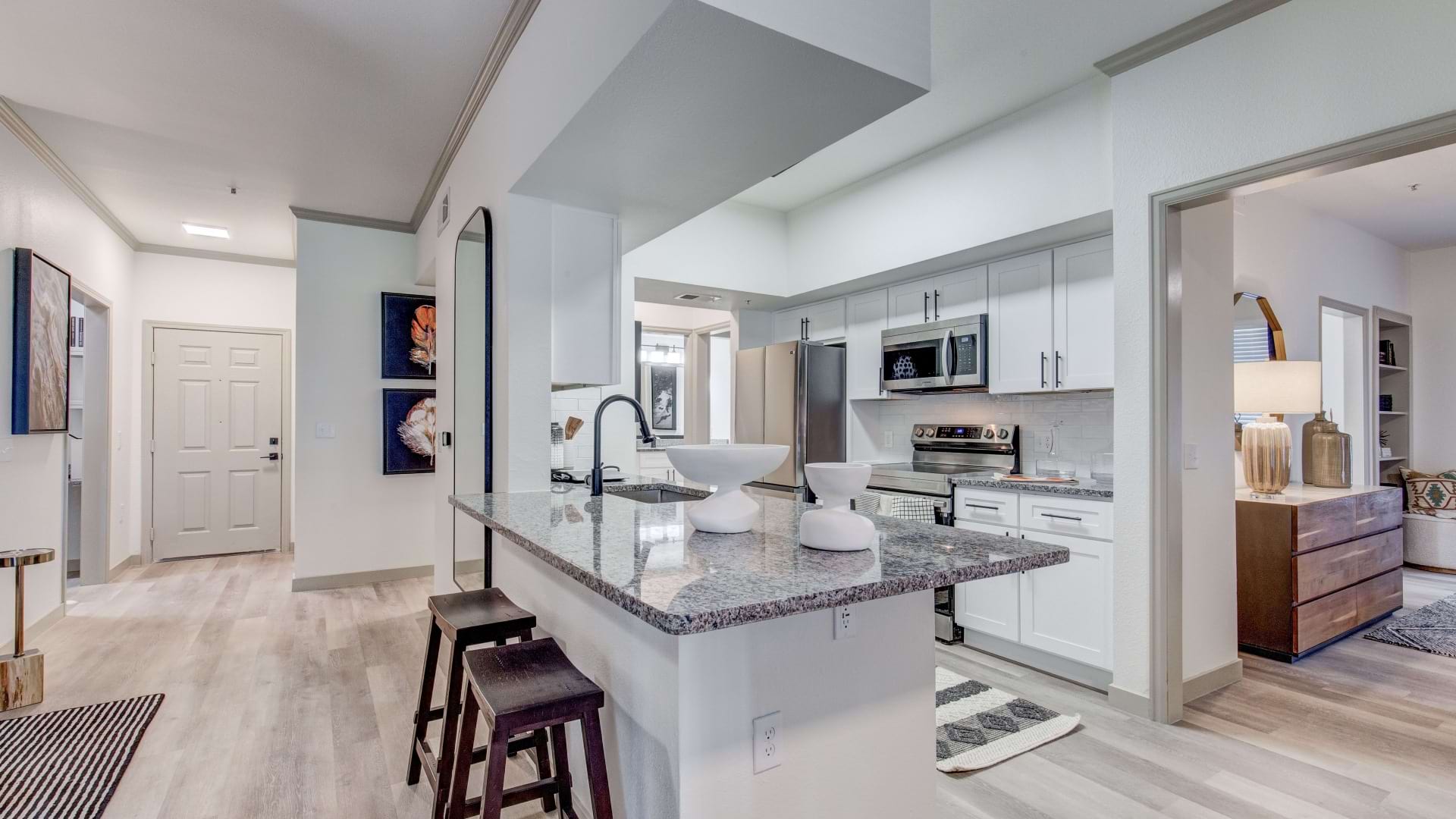 Open-Concept Kitchen with Granite-Style Countertops at Our Westminster Apartments for Rent