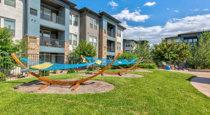 Poolside Hammocks and Fire Pit at Our Apartments on Ronald Reagan Blvd