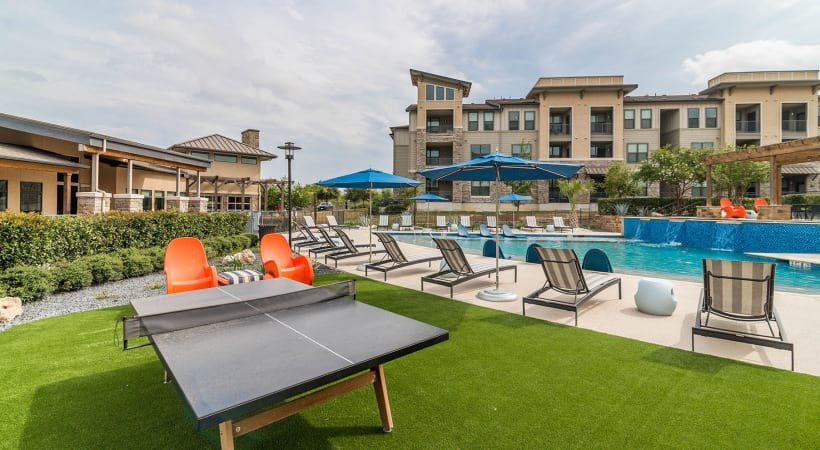 Poolside Lounge with Games at Our Apartments on West Ave. in San Antonio