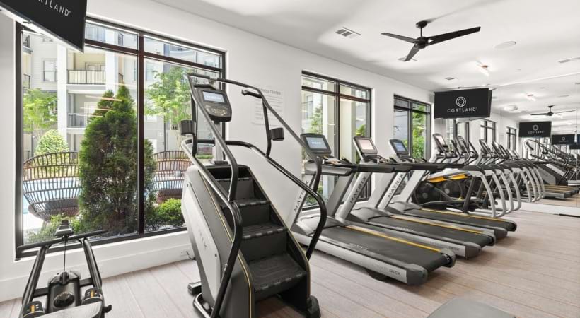 Spacious Fitness Center with Peloton® Bikes and Other Cardio Equipment at Our Perimeter Center Apartments