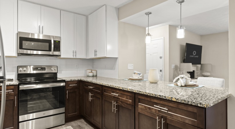 Kitchen with Stainless Steel Appliances  at Our Apartments in Cumberland, GA