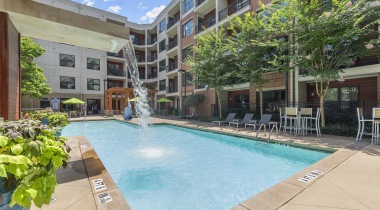 Our Emory University Apartments with a Resort-Style Pool and Lounge Chairs