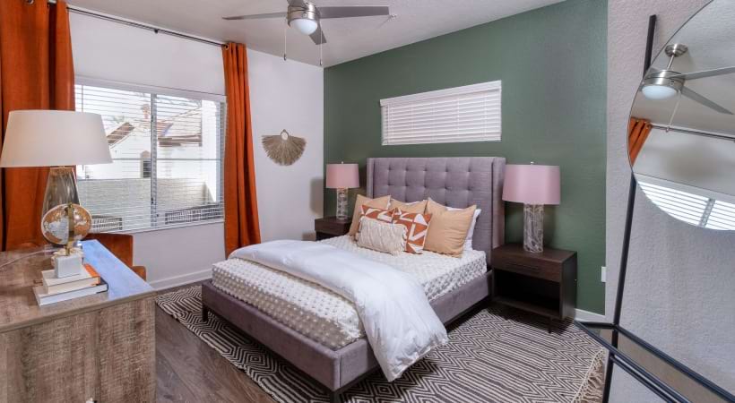 Bedroom with Wood-Style Flooring at Our Desert View Apartments in Phoenix, AZ