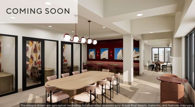 Newly Renovated Coworking Space with Tables and Chairs at Our Pentagon Row Apartments for Rent