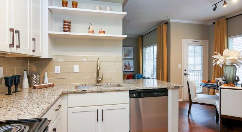 Kitchen with Designer Tile Backsplash at Cortland on Cherry Creek