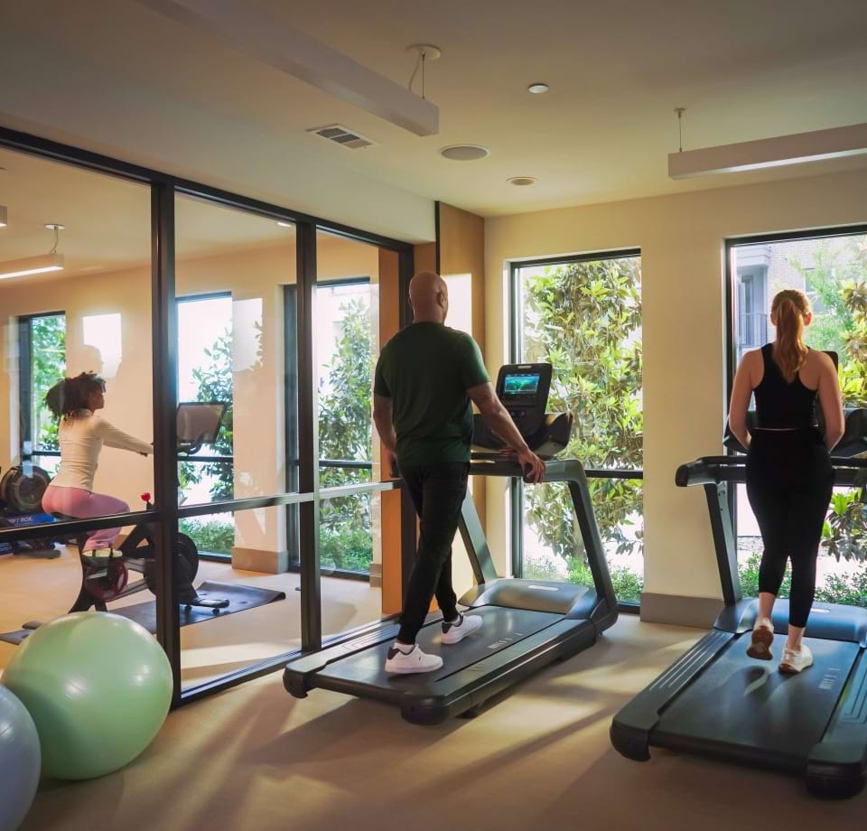 Residents Exercising in the Yoga Studio at Our Cortland Apartment Community