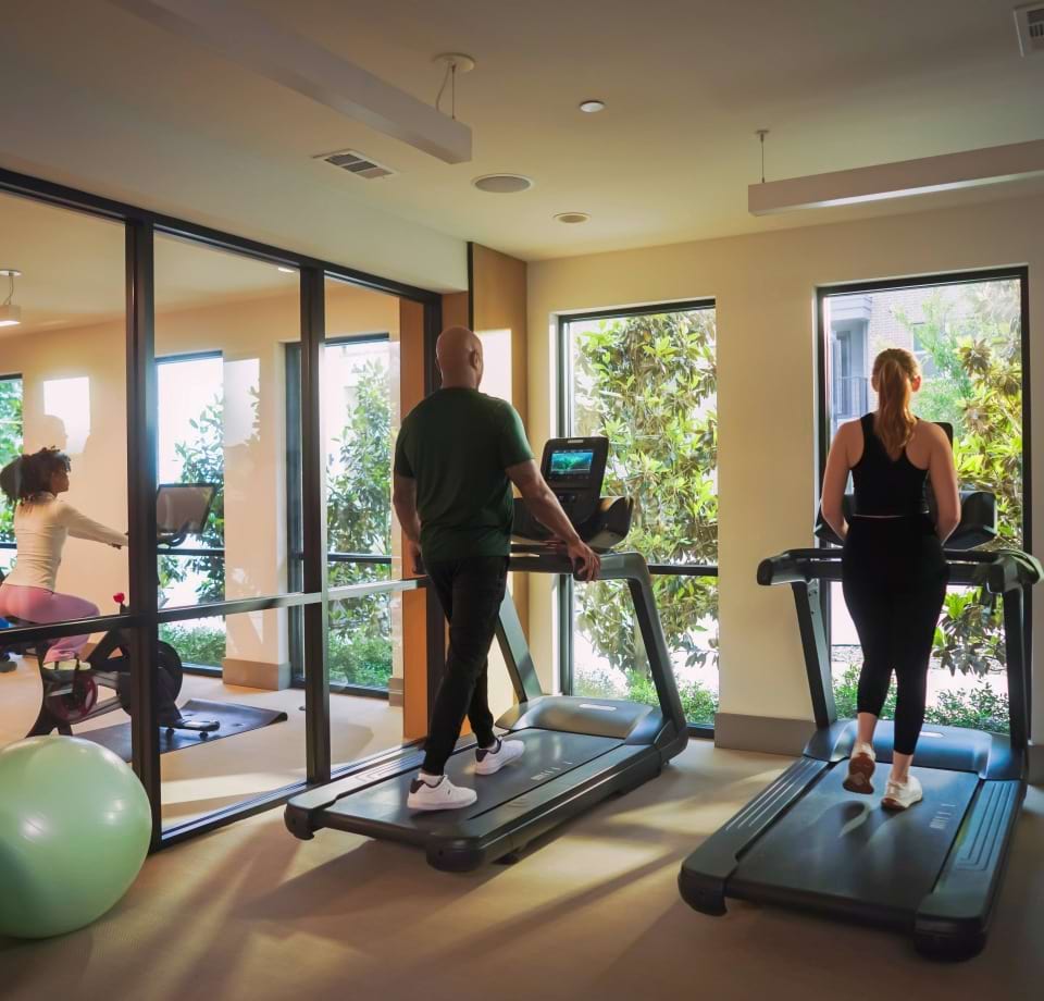 Cortland Residents Doing Yoga at the Fitness Center at Our Cortland Apartment Community