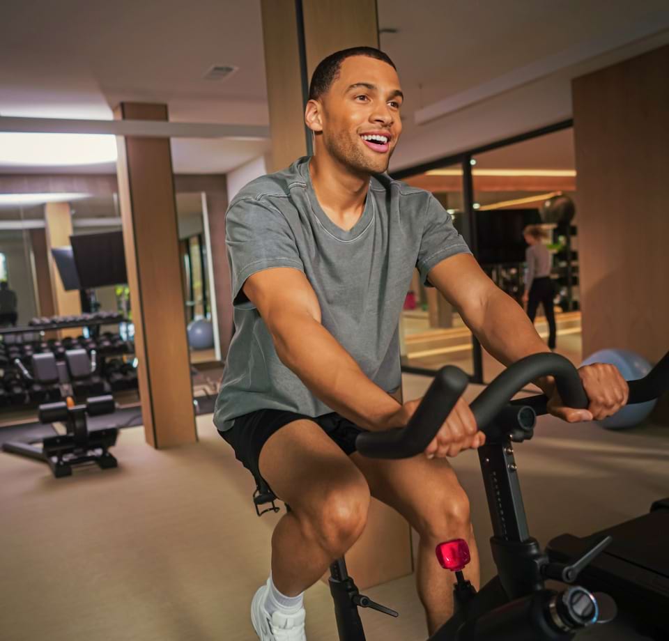 Residents Using the Equipment in the Fitness Center at Our Cortland Apartment Community