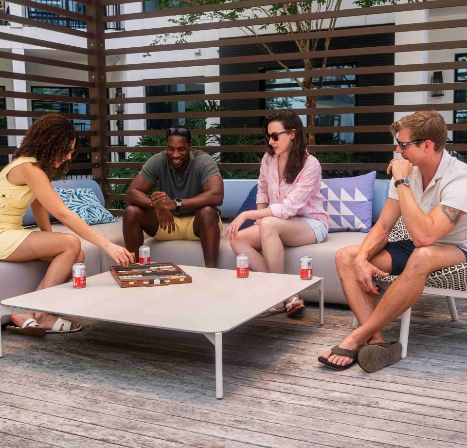 Residents Socializing Around a Fire Pit at Our Cortland Apartments