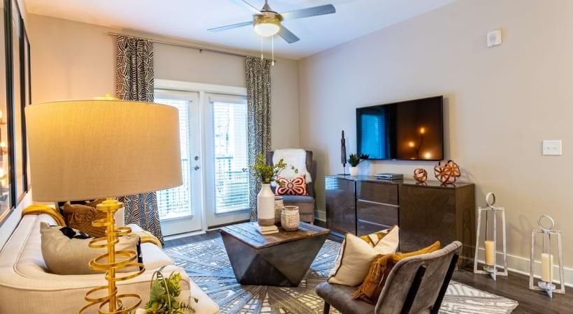 Living Room Area with Wood-Style Flooring at Our Apartments in For Rent Near Chamblee