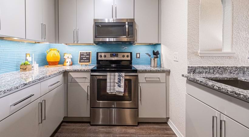 Kitchen with Granite Countertops at Our Apartments for Rent in Palm Beach Lakes, FL