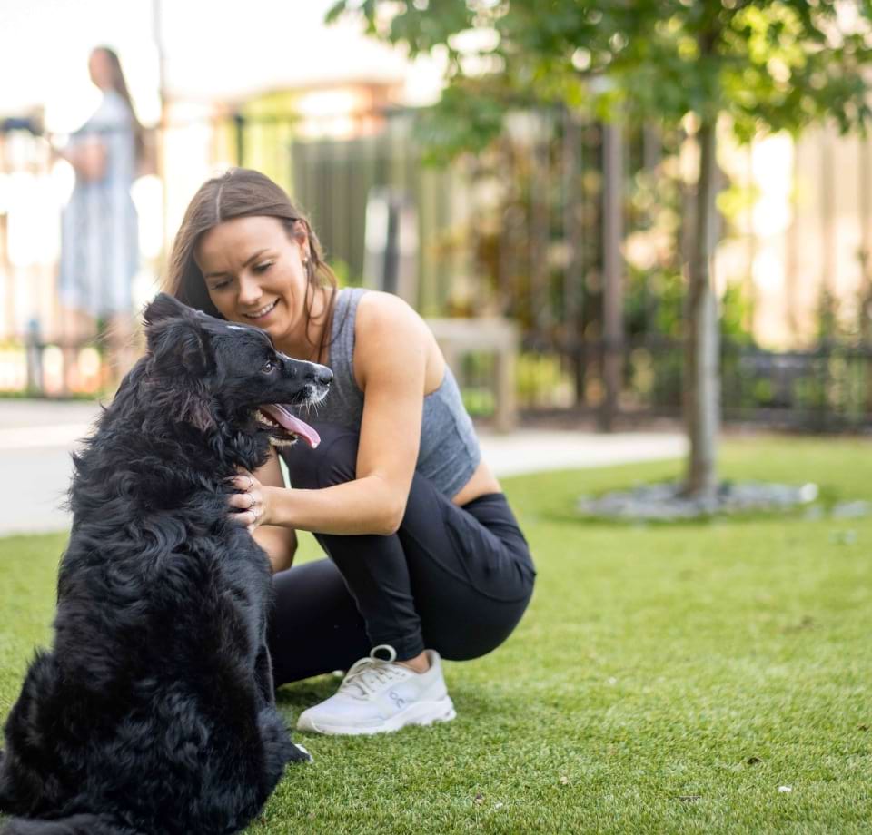A Furry Resident Enjoying the Leash-Free Bark Park at Our Pet-Friendly Cortland Apartment Community