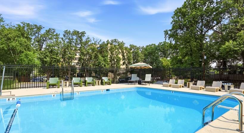 Resort-Style Pool and Sun Deck with Lounge Chairs at Our Apartments in Falls Church, VA
