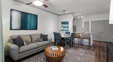 Living Room with Wood-Style Flooring in Our Apartments in The Colony, Texas