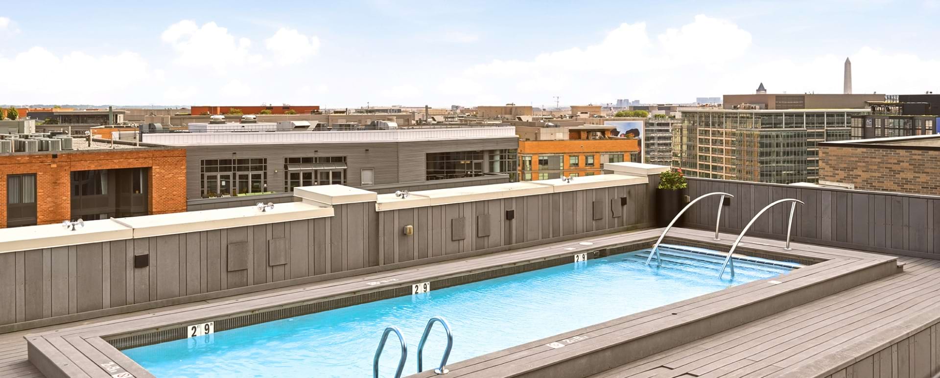 Rooftop Pool with Lounge Chairs at Our Truxton Circle Apartments