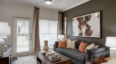 Spacious Living Room with Wood-Style Flooring at Our Apartments Near Katy