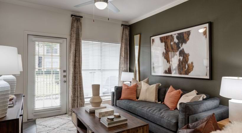 Spacious Living Room with Wood-Style Flooring at Our Apartments Near Katy