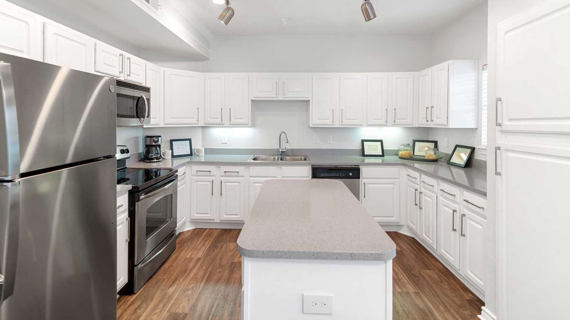 Spacious Kitchen with an Island at Our Apartments on Cooper St.