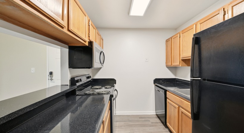 Upscale Kitchen with Modern Cabinetry with Designer Hardware at Our Heritage Way Apartment Homes