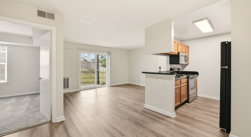 Open Floor Plan Living Area with Wood-Style Flooring at Our Modern Apartments in Leesburg