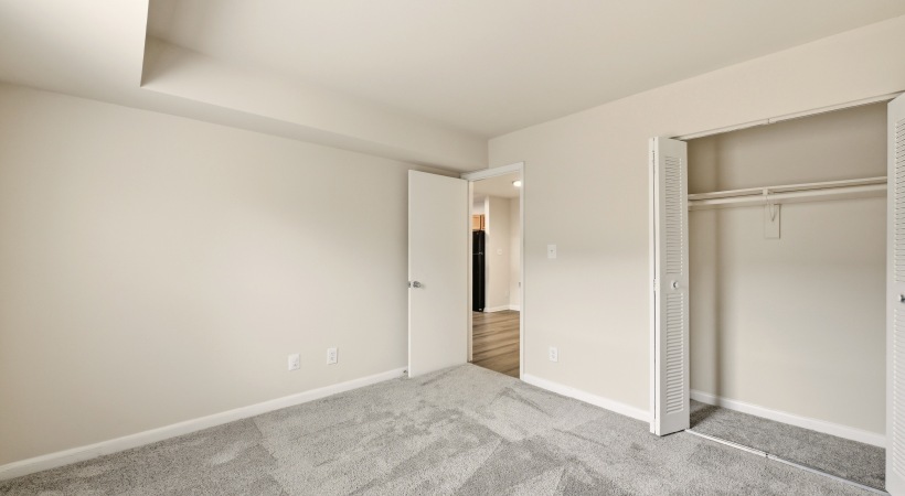 Modern Bedroom with a Spacious Closet at Our Downtown Leesburg Apartment Homes