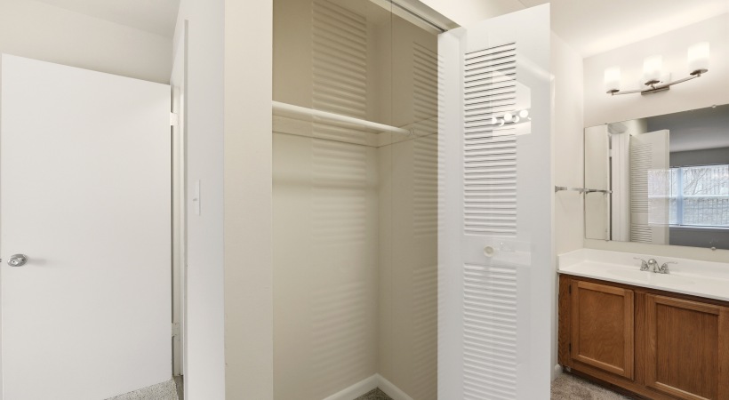 Bedroom with Ensuite Bathroom and Spacious Closets at Our Apartments in Loudoun County, VA