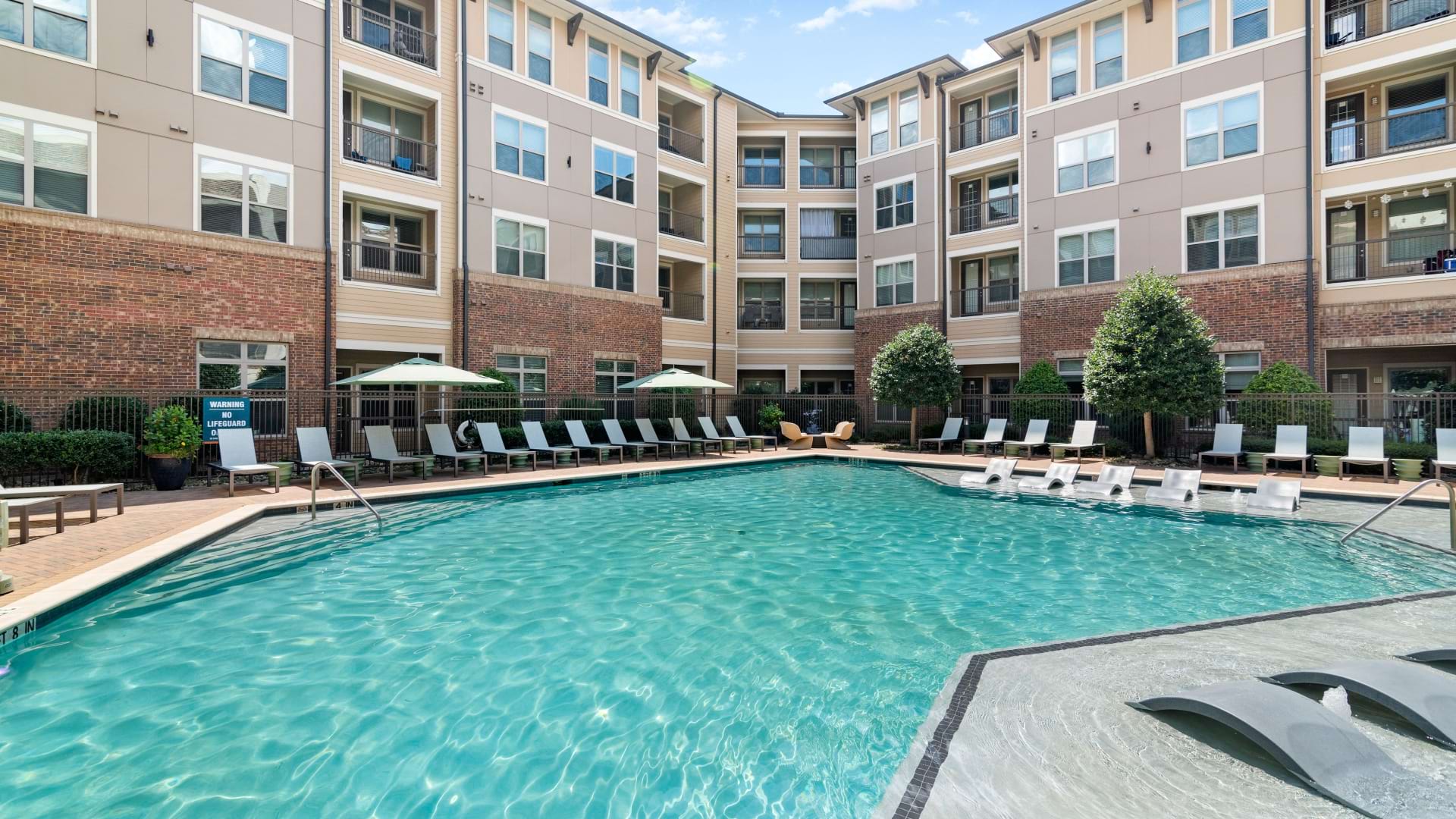 Resort-style pool and sun deck at our luxury apartments in Frisco, TX