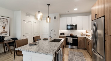 Kitchen with Wood-Style Flooring at Our Luxury Apartments in Lewisville, Texas