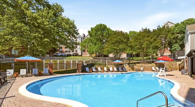 Resort-Style Pool with Lounge Chairs Nearby at Our Apartments Near the Van Dorn Metro