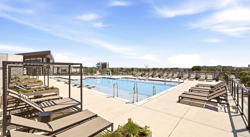 Rooftop Pool with Lounge Chairs at Our Apartments Near DCA