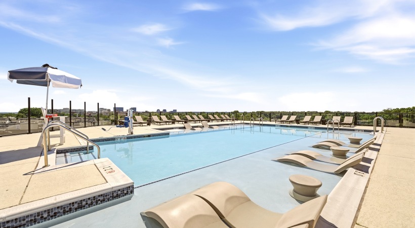 Rooftop Pool with Lounge Chairs at Our Columbia Pike Apartments in VA