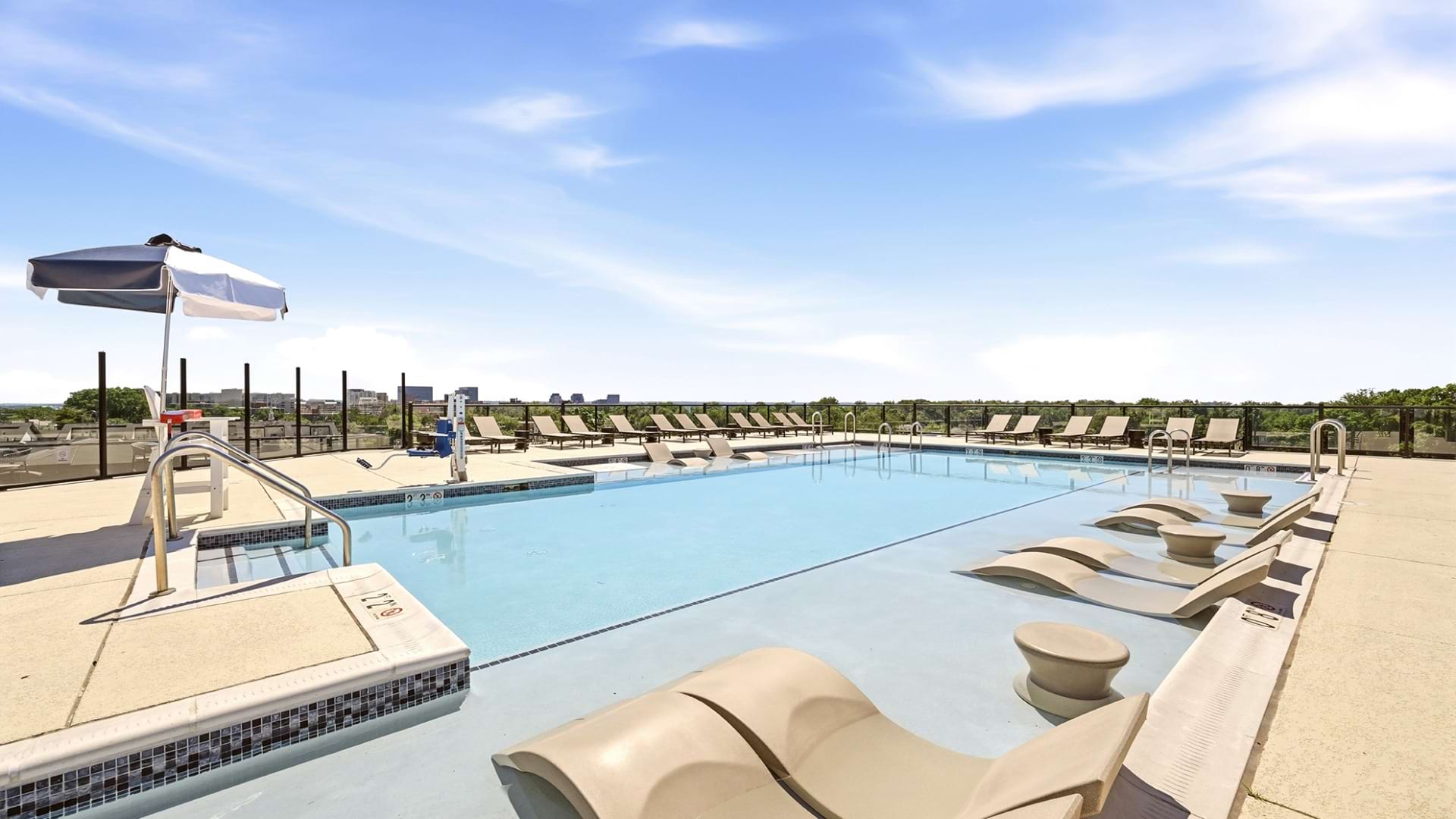 Rooftop Pool with Lounge Chairs at Our Columbia Pike Apartments in VA