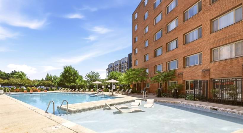 Resort-Style Pool and Sun Deck with Lounge Chairs at Our Apartments for Rent Near Columbia Pike in Arlington, VA