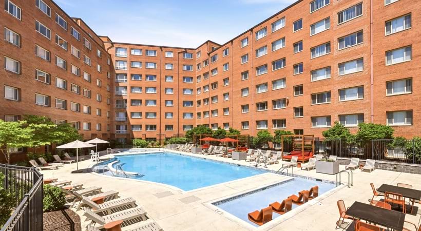 Resort-Style Pool and Sun Deck with Lounge Chairs at Our Apartments Near Columbia Pike