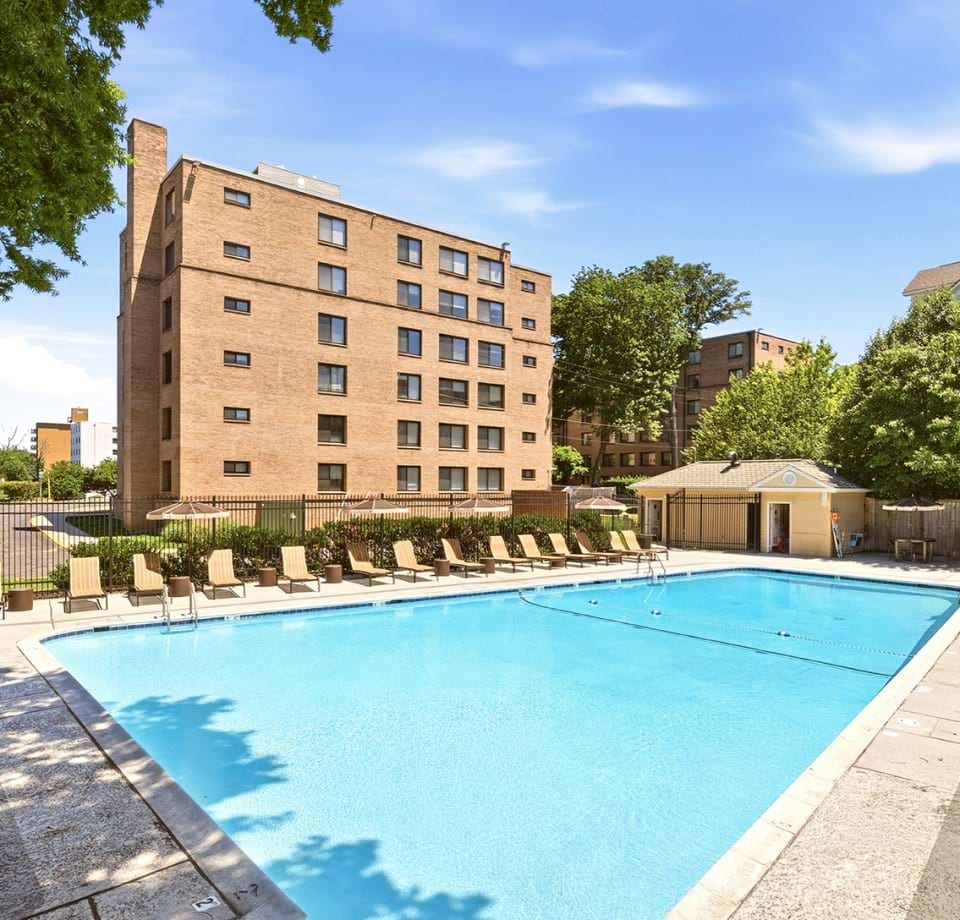 Resort-Style Pool and Sun Deck with Lounge Chairs at Our Apartments Near Georgetown University Washington, DC