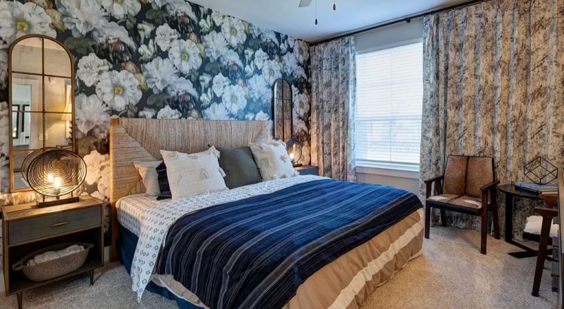 Spacious Bedroom with an Accent Wall in Our Apartments on 96 in League City