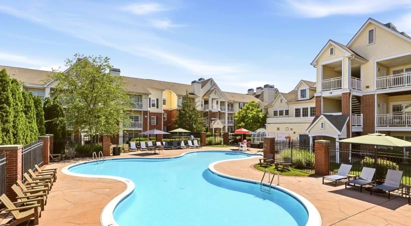 Resort-Style Pool and Sun Deck with Lounge Chairs at Our Apartments Near Herndon, VA