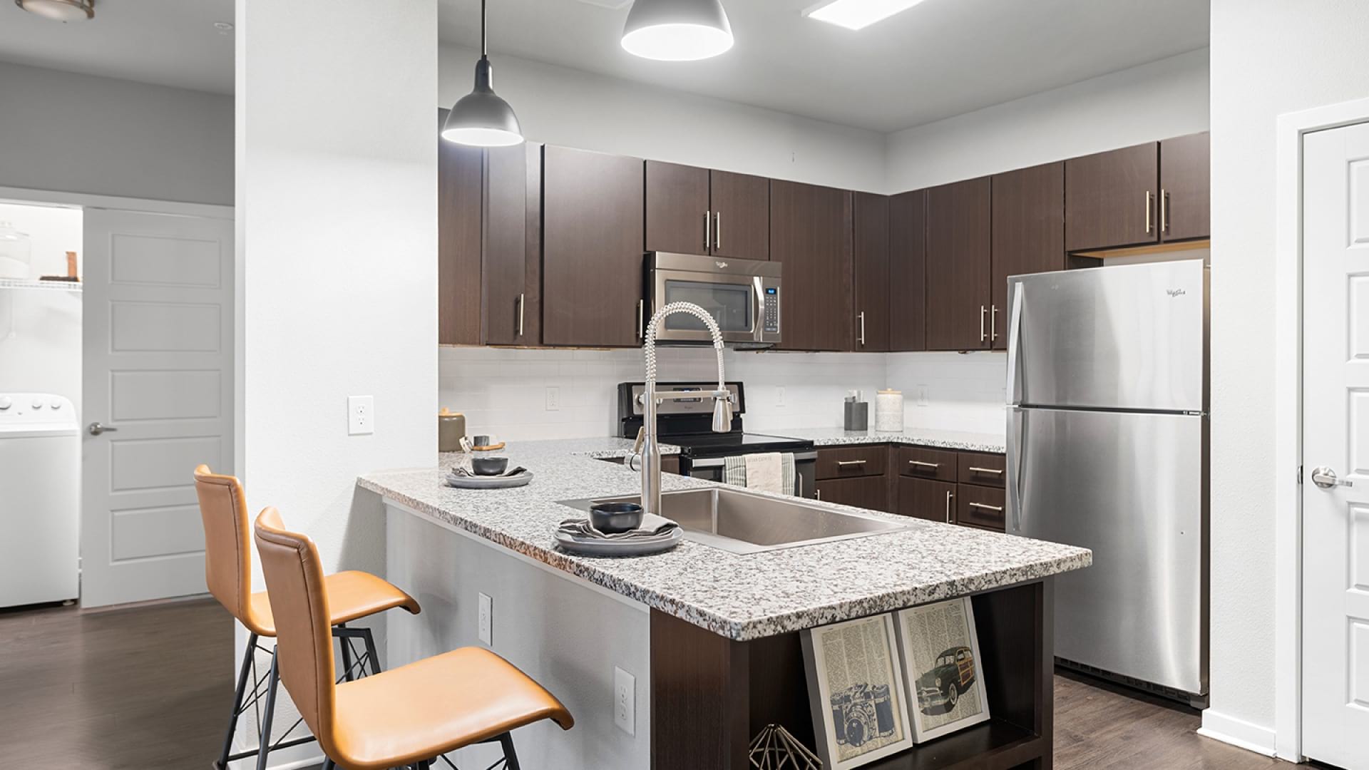 Kitchen with a Breakfast Bar at Our SoCo Apartments in Austin