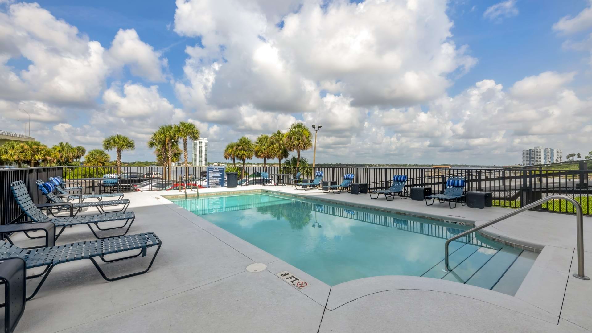 Swimming Pool with Lounge Chairs at Our Daytona Beach Apartment Community